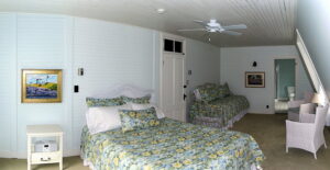 The Reid Room - View 1 -- Named after the original owner of the Grey Havens Inn, the Reid Room is a larger room on the back corner of the inn with a king bed, as well as a twin bed, private bath and a side view Harmon’s Harbor.