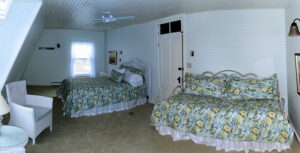 The Reid Room - View 2 -- Named after the original owner of the Grey Havens Inn, the Reid Room is a larger room on the back corner of the inn with a king bed, as well as a twin bed, private bath and a side view Harmon’s Harbor.