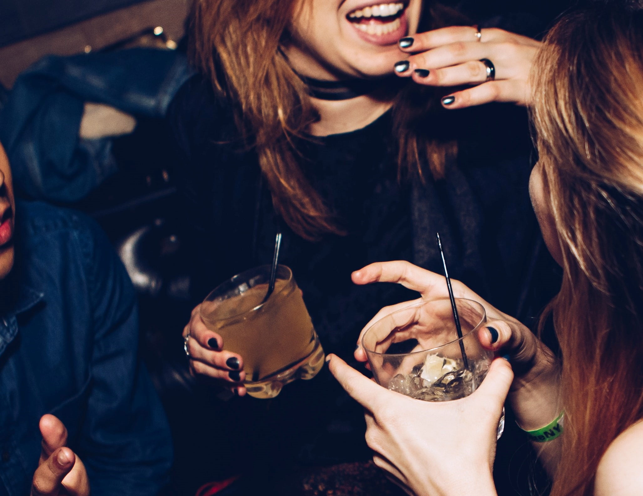 People enjoying drinks at the bar at BLUE